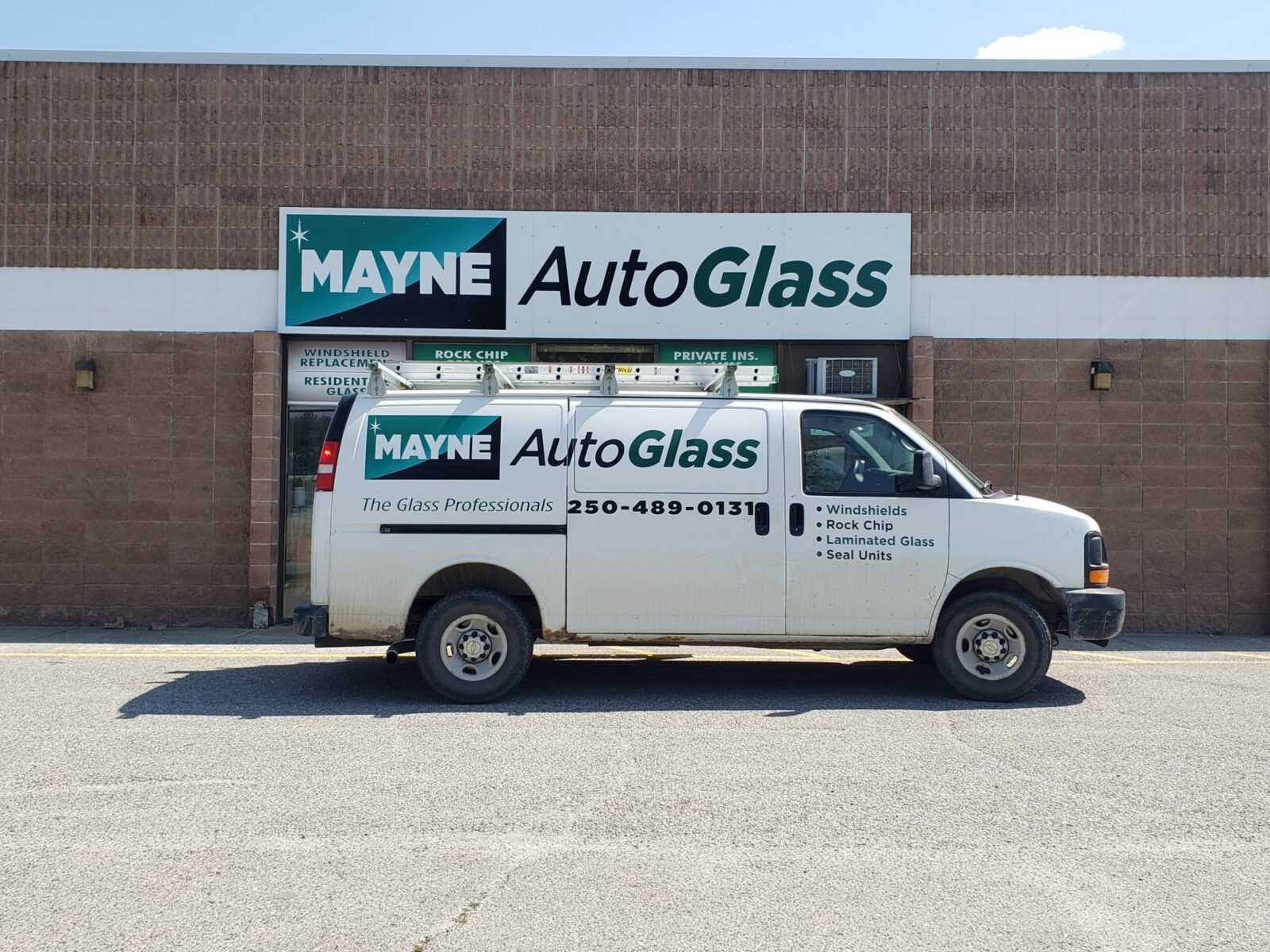 Mayne Auto Glass technician servicing a BC Transit bus windshield